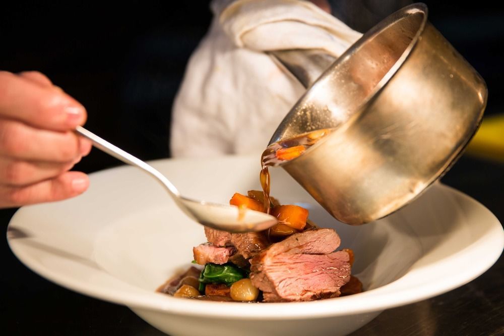The Millstone, Mellor Hotell Blackburn  Exteriör bild A chef plating a dish
